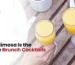 Lush Cafe Mimosa brunch cocktail served in flutes, perfect for weekend brunch with fresh orange juice and sparkling wine